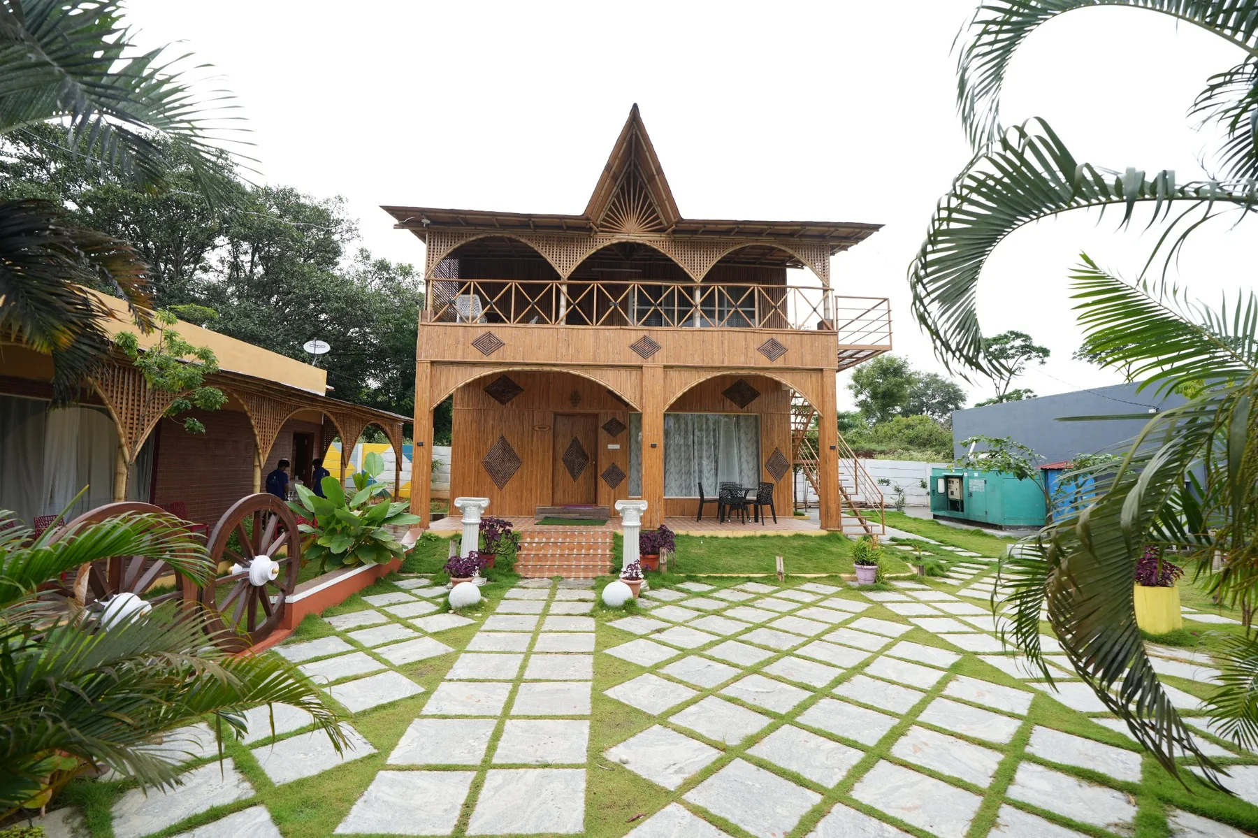 Two-storey bamboo cottage and landscaped garden at Secret Valley Retreat